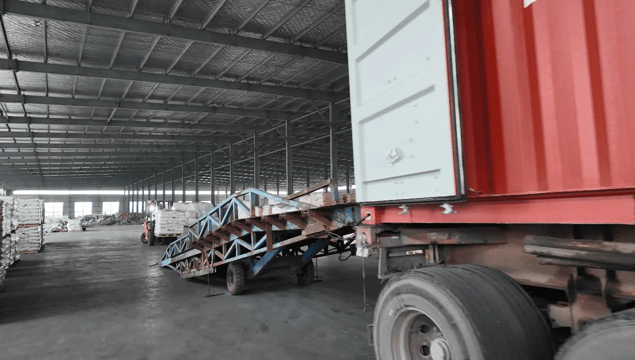 Shipping container positioned at the warehouse loading ramp during container stuffing
