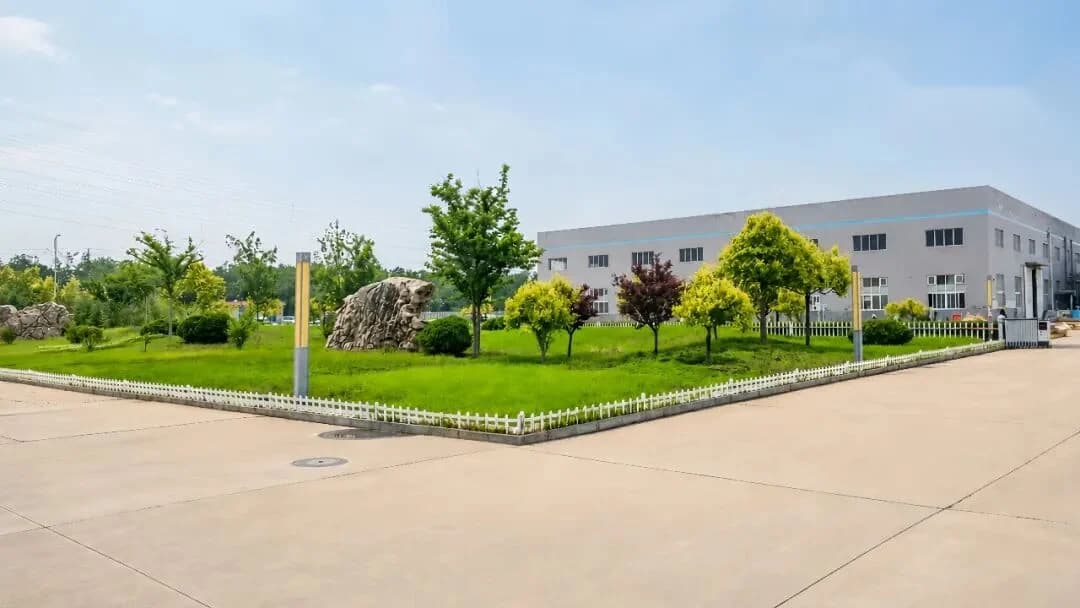 Landscaped entrance grounds and workshop building at the Zhongzhi facility