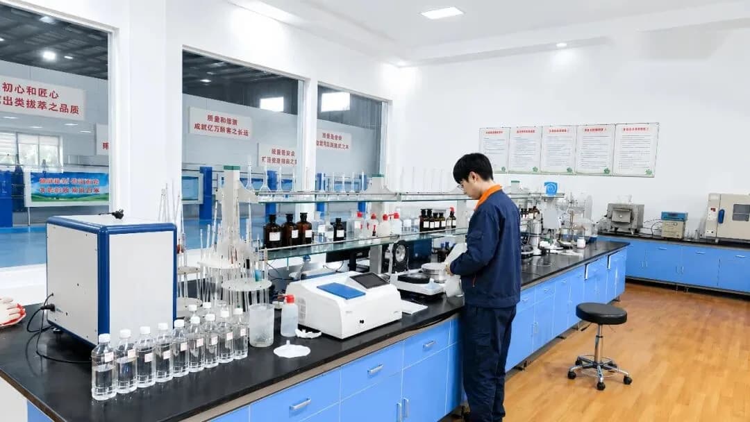 Zhongzhi quality-control laboratory with a technician at the analysis bench
