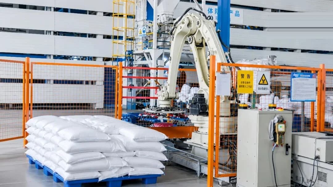 Branded robotic palletizing cell stacking bagged sodium metasilicate onto pallets