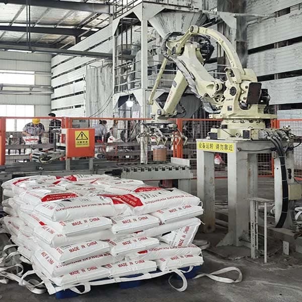 Second palletizing line: Kawasaki robot arm stacking 25 kg sodium metasilicate bags onto a pallet