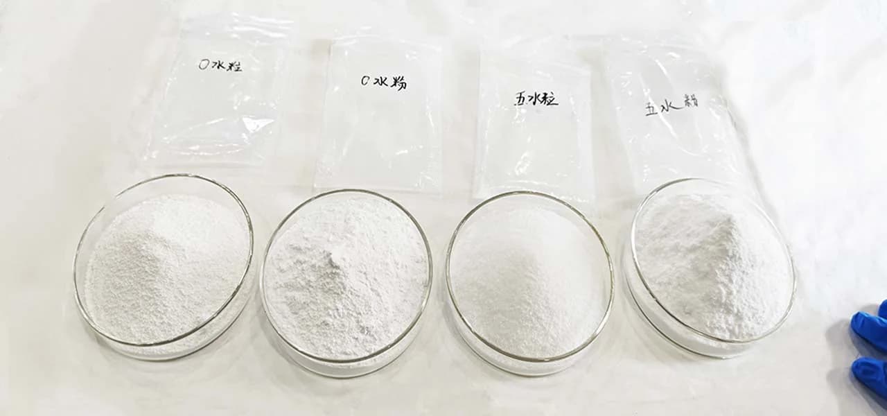 Four sample dishes: Anhydrous Granular, Anhydrous Powder, Pentahydrate Granular, Pentahydrate Powder